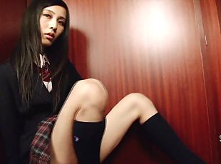 Shemale dressed in a schoolgirl uniform pulls on her hard dick