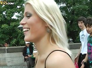 Blonde beauty undresses in public